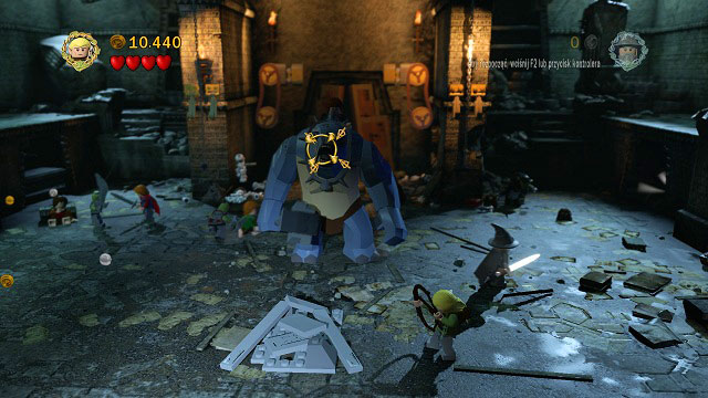 One of the hobbits will jump on the troll’s back – after a couple hits (H) the troll will be stunned – you can use this chance to change to Legolas and shoot an arrow at him - The Mines of Moria - Walkthrough – Act I - LEGO The Lord of the Rings - Game Guide and Walkthrough