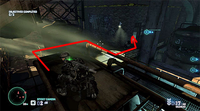 Eventually, you should make it to the dimly-lit area show in the screenshot where, apart from a single enemy, you also need to watch out for a security camera - Mission 3 – Hackers Den - Optional missions assigned by Grim - Tom Clancys Splinter Cell: Blacklist - Game Guide and Walkthrough