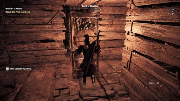 ตอนนี้เลื่อนชั้นวางที่สองภายในรอยแตกเพื่อเปิดเผยข้อความ - AC Odyssey: Tombs in Attika - Tombs - Assassins Creed Odyssey Guide
