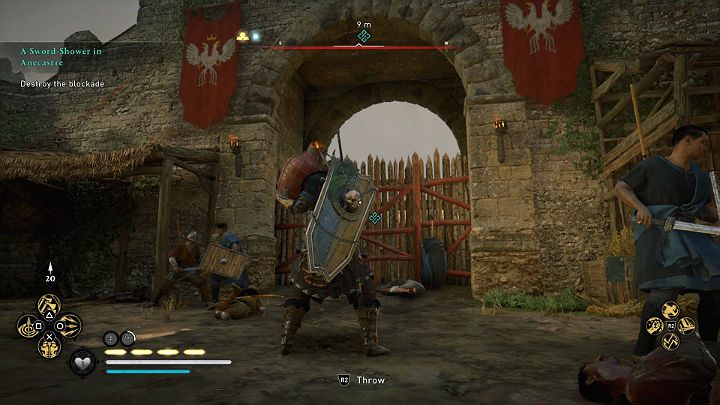 You can destroy the wooden blockade in two ways: blow it up (you will find oil jugs on the left side, next to the spare boxes) or shoot the obstacle using the ballista - Assassins Creed Valhalla: A Sword-Shower in Anecastre - walkthrough - Lincolnscire - Assassins Creed Valhalla Guide