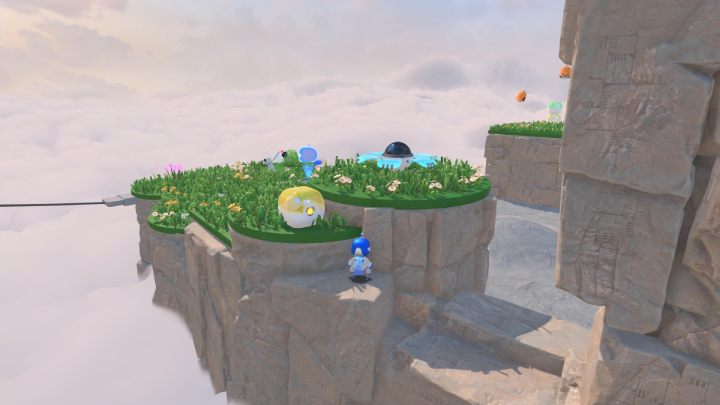 Go up the stairs and collect the coins from the yellow container - Astros Playroom: Gusty Gateway - walkthrough - Meadow of Remembrance - Astros Playroom Guide