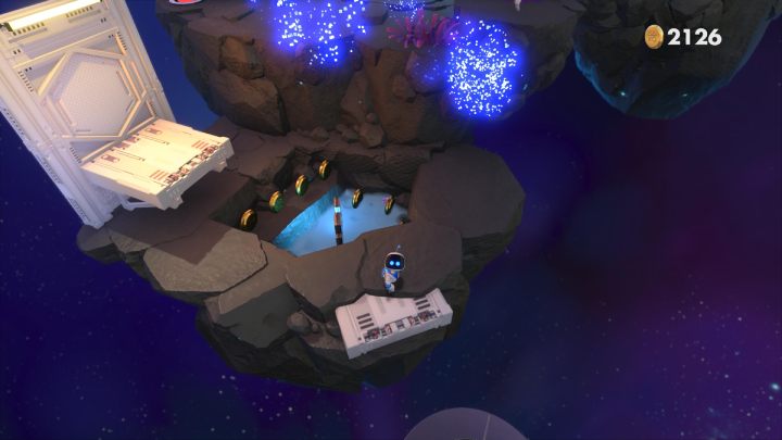Use the circular platform to jump over to the next rock - Astros Playroom: Deep Dataspace - walkthrough - SSD Highway - Astros Playroom Guide