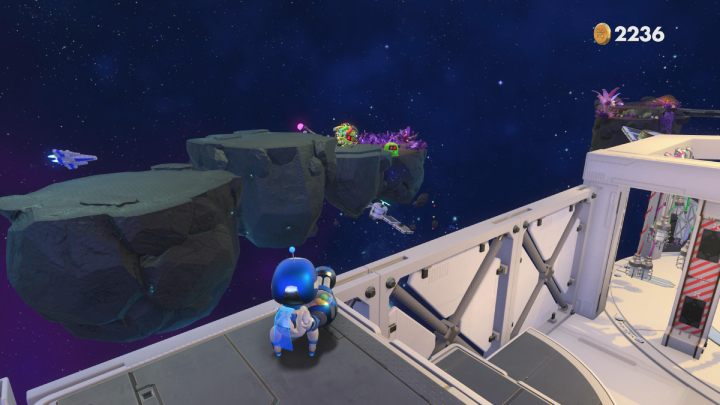 Once you jump on a rock, some opponents will appear - Astros Playroom: Deep Dataspace - walkthrough - SSD Highway - Astros Playroom Guide