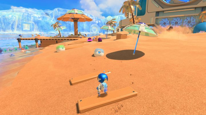 Gehen Sie zurück zum Kontrollpunkt und sammeln Sie die Münzen aus den blauen und grünen Kanistern – Astros Playroom: Bot Beach – Komplettlösung – Cooling Springs – Astros Playroom Guide