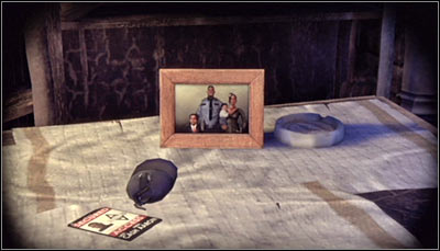 Zoom in on the items on the table, especially including Aarons Cash ID (screen above) - Riddles | Park Row - Park Row - Batman: Arkham City Game Guide