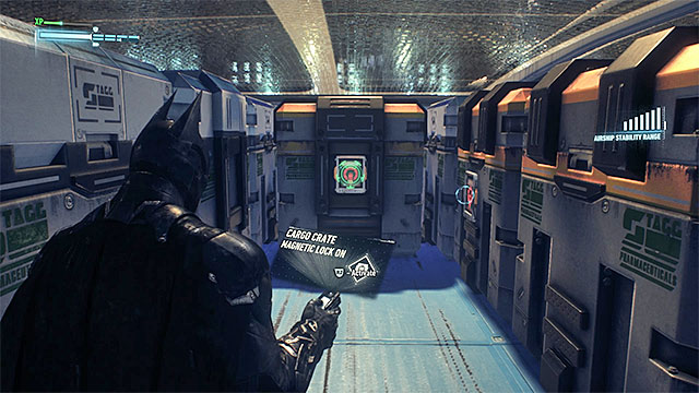 Take the manhole to descend to a lower level and walk between the big containers - Riddler trophies in the Stagg Airships (1-10) | Collectibles - Stagg Airships - Collectibles - Stagg Airships - Batman: Arkham Knight Game Guide & Walkthrough