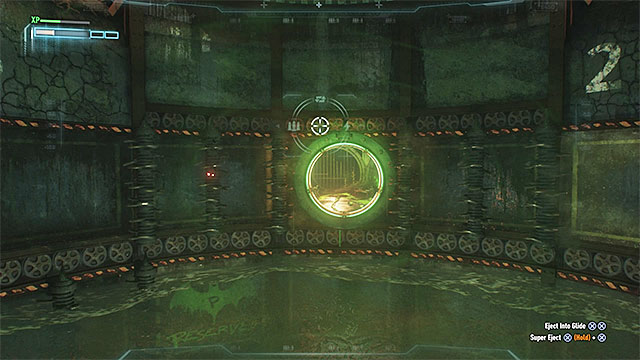 Keep lowering the batmobile, up to the point at which it is located right above the operating drills - Seventh Riddler trial - Riddles and challenges - Batman: Arkham Knight Game Guide & Walkthrough