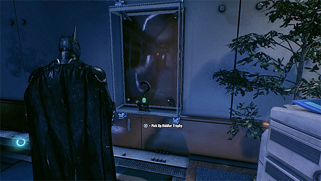 Break the glass and take the trophy - Riddler trophies in GCPD Lockup | Collectibles - GCPD Lockup - Collectibles - GCPD Lockup - Batman: Arkham Knight Game Guide & Walkthrough