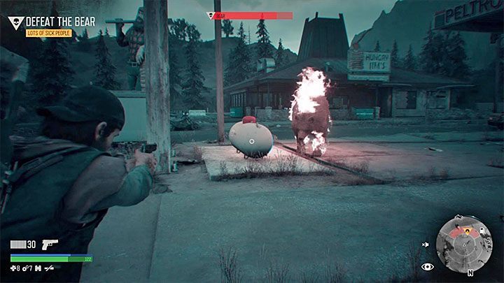 Even better way to weaken the enemy is to stand near the big white container shown in the image - Days Gone: Bear boss in Lots of Sick People - how to kill? - FAQ - Days Gone Guide