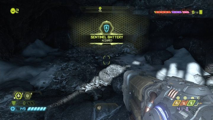 You will find the battery on a small stone ledge - Doom Eternal: Cultist Base secrets maps and location - Collectibles and secrets - Doom Eternal Guide