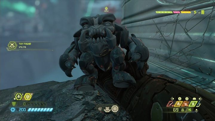 The figurine is located on a rock ledge on the left side of the building - Doom Eternal: Urdak secrets maps and location - Collectibles and secrets - Doom Eternal Guide
