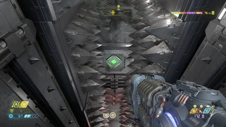 Shoot the button immediately after the spikes are moving away from each other, and aim the jump so that you will able to fall down, pass through an open passage and grab the wall - Doom Eternal: Cultist Base walkthrough - Levels walkthrough - Doom Eternal Guide