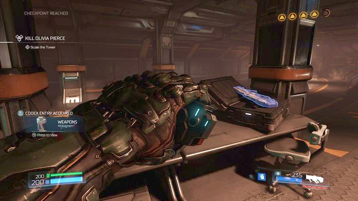 Once youre above, use the stairs to enter the room with the health station and a Hologram - Argent Energy Tower | Walkthrough - Walkthrough - Doom Game Guide & Walkthrough