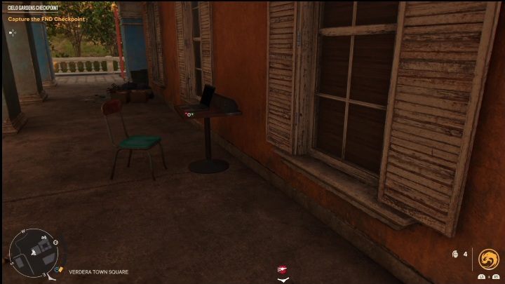 This USB Stick lies on a small, wooden table next to a laptop - Far Cry 6: USB Songs - list, locations - Other - Far Cry 6 Guide