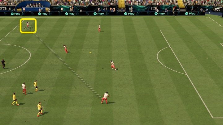 Performing a lob pass is a classic play intended to shift the weight of the game onto the other side of the field - FIFA 22: Passes - Basics - FIFA 22 Guide