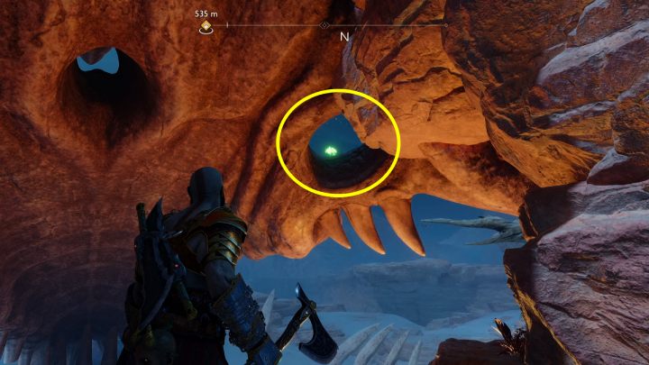 The bird is perched in one of the skeleton's eye sockets - God of War Ragnarok: The Barrens, Alfheim - secrets, collectibles - Alfheim - God of War Ragnarok Guide