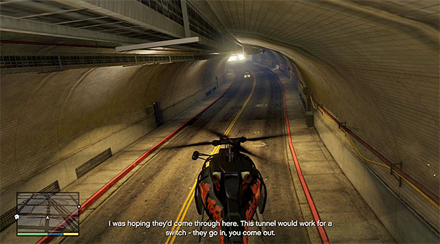 Towards the end of this phase, the vans will drive into a tunnel and, if you are planning on completing this mission in 100%, you need to fly into that tunnel also (the above screenshot) - 58: Surveying the Score - Main missions - Grand Theft Auto V Game Guide