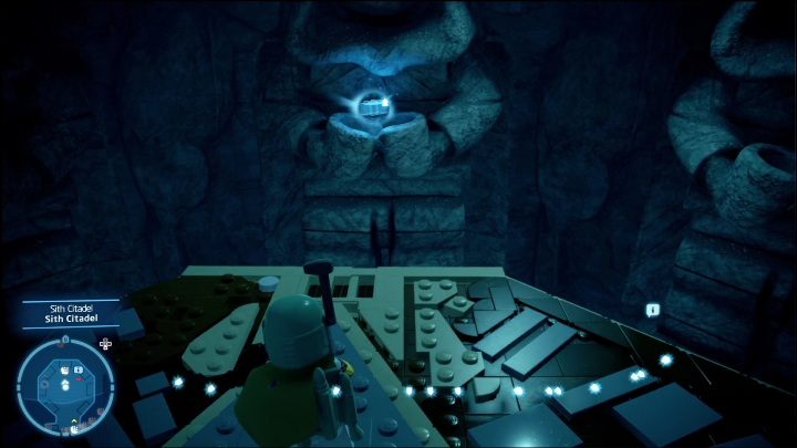 This brick is lying in the palms of the statue you will pass while riding down the elevator to the Citadel - LEGO Skywalker Saga: Sith Citadel - list of all puzzles - Exegol - LEGO Skywalker Saga Guide