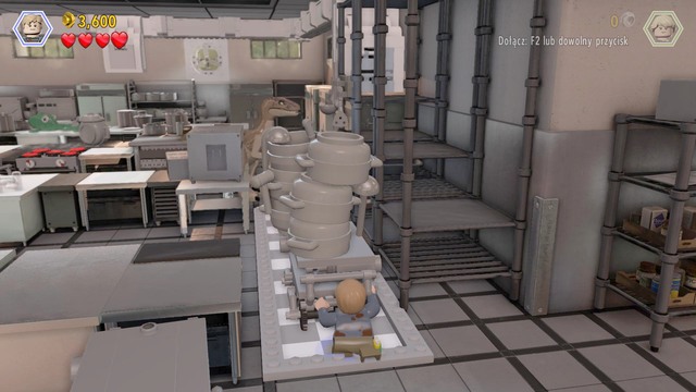 Atop the shelf, walk over to the venting shaft and, at the other side, move another trolley towards the dinosaur, which will make way for Murphy - Visitor center | Jurassic Park - walkthrough - Jurassic Park - walkthrough - LEGO Jurassic World Game Guide & Walkthrough