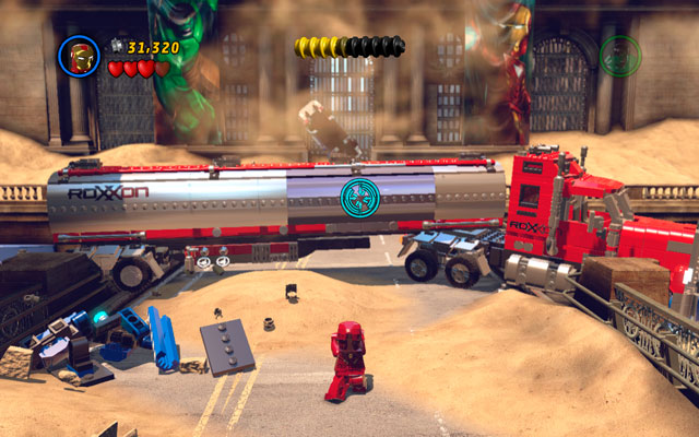 Approach to the next truck and use Iron Mans rocket attack - aim on the silver part of the vehicle and release the missiles - Sand Central Station | Walkthrough - Walkthrough - LEGO Marvel Super Heroes Game Guide & Walkthrough