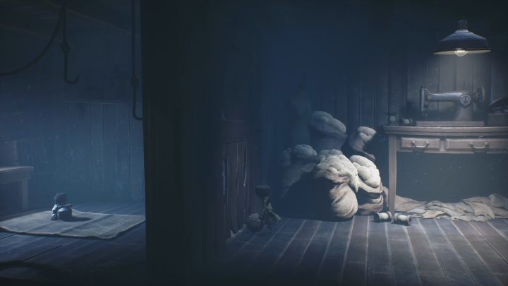 Move to the wall on the left and you will see Six sitting on the carpet - Little Nightmares 2: A Cottage in the Forest - walkthrough - Chapter 1 - Forest - Little Nightmares 2 Guide