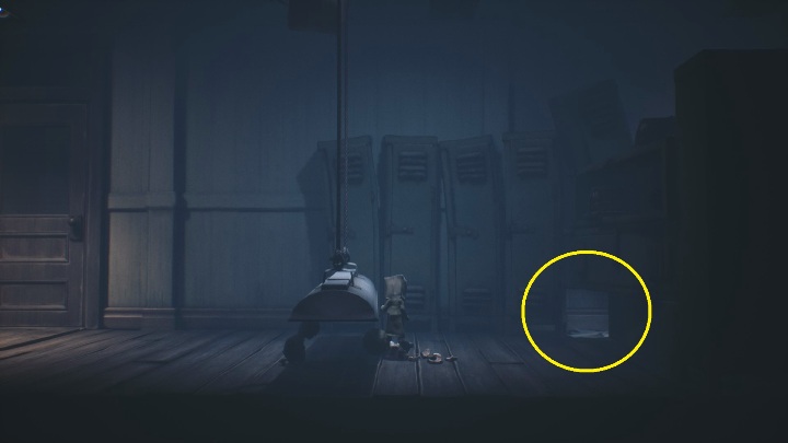 Moving on, you have to squeeze under the lamp and then crawl into the hole between the cabinets - Little Nightmares 2: School - guide, walkthrough description - Chapter 2 - Orphanage - Little Nightmares 2 Guide