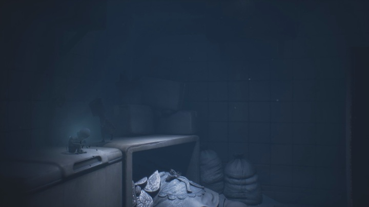 The Glitching Remains lie on the tabletop - Little Nightmares 2: Glitching Remains, Chapter 2 Orphanage - list of all - Glitching Remains - Little Nightmares 2 Guide
