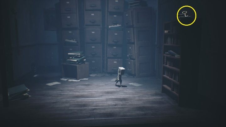 The key is located on the cabinet, to get to it you have to knock it over - Little Nightmares 2: School - Chapter 2 Orphanage walkthrough - Chapter 2 - Orphanage - Little Nightmares 2 Guide