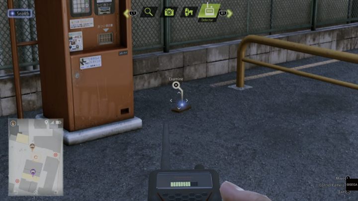 Using a detector, examine the wallet lying in the parking lot - Lost Judgment: Dastardly Detective The Eavesdropping Wallet - walkthrough - Side Cases - Lost Judgment Guide