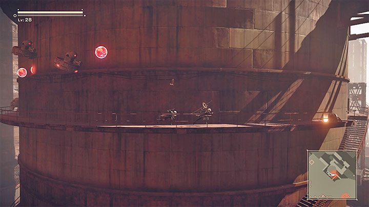 Data Chip E is at the end of one of the metal balconies surrounding the huge silo - NieR Automata: City Ruins - walkthrough, side quests - Side missions - NieR Automata Guide