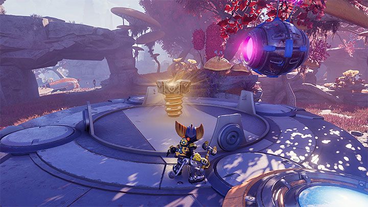 The last step is to get on the pressure plate to disable the force field surrounding the collectible - Ratchet & Clank Rift Apart: Savali - collectibles, list of all, map - Secrets and Collectibles - Ratchet & Clank Rift Apart Guide