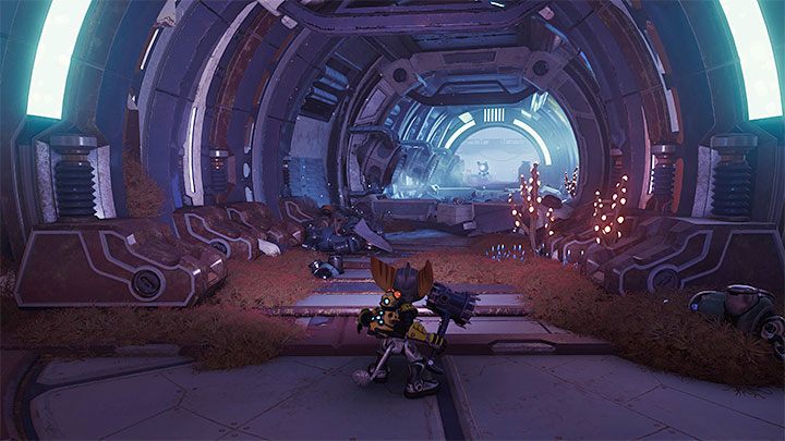 You can leave this room (the entire floor is now safe to land on) and follow the friendly Junk Bot down the main corridor to the south - Ratchet & Clank Rift Apart: Find the Rubion Forge - walkthrough - Cordelion - Ratchet & Clank Rift Apart Guide