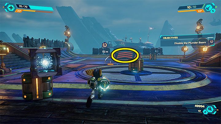 In order to reach the Plunder Beam, use the ramp with the arrows shown in the image above - Ratchet & Clank Rift Apart: Protect Captain Quantum - walkthrough - Ardolis - Ratchet & Clank Rift Apart Guide