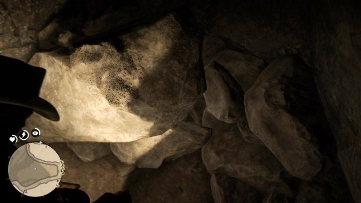 In den Tiefen der Höhle finden Sie zwischen den vielen großen Felsen Goldbarren – Red Dead Redemption 2: Goldbarren – wie bekommt man sie, wo verkauft man sie?  - Die Spielwelt erkunden – Red Dead Redemption 2 Guide