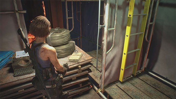 Die Notiz befindet sich auf einem der höheren Gerüste des brennenden Demolition Site-Gebäudes – Resident Evil 3: Geheimnisse, Sammlerstücke von Demolition Site – Sammlerstücke und Geheimnisse – Resident Evil 3 Guide