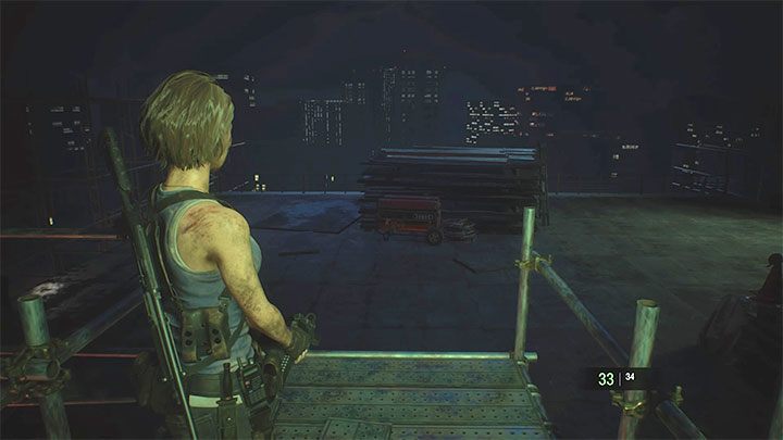 Start the fight by jumping off scaffolding onto the roof shown in the picture - Resident Evil 3: Nemesis - Demolition Site boss fight - Nemesis boss fights - Resident Evil 3 Guide