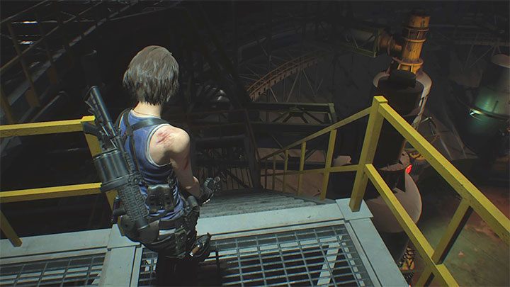 Das dritte Pflichtduell mit Nemesis beginnt kurz nach dem Verlassen des Pausenraums der Arbeiter und dem Versuch, die im Bild gezeigte Treppe zu nehmen – Resident Evil 3: Komplettlösung für das letzte Duell mit Nemesis – Komplettlösung für die Geschichte – Resident Evil 3-Anleitung