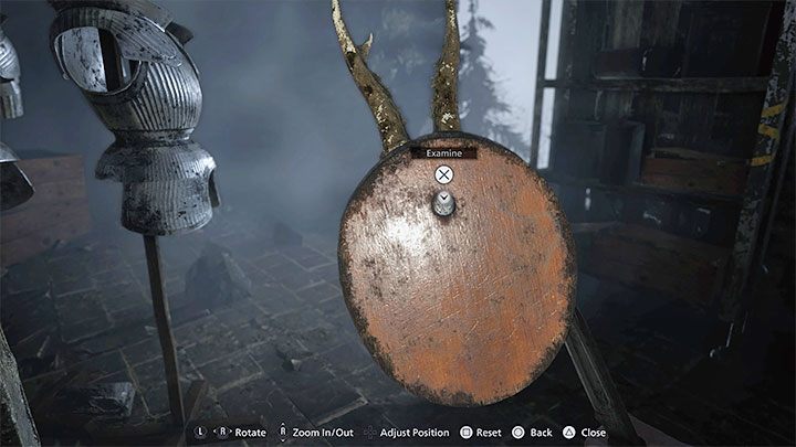 After winning the fight, look around the armory for the Mounted Animal Skull shown in the picture - Resident Evil Village: Castles Courtyard - walkthrough - Dimitrescu Castle - Resident Evil Village Guide