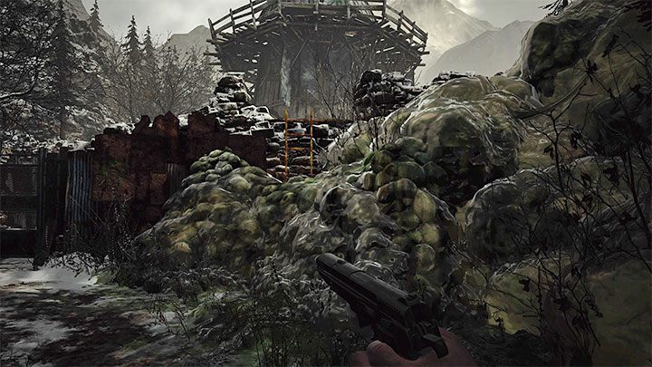 Walk along the narrow path until you reach another slime barrier - Resident Evil Village: Going through the village to the boat - walkthrough - Fortress - Resident Evil Village Guide