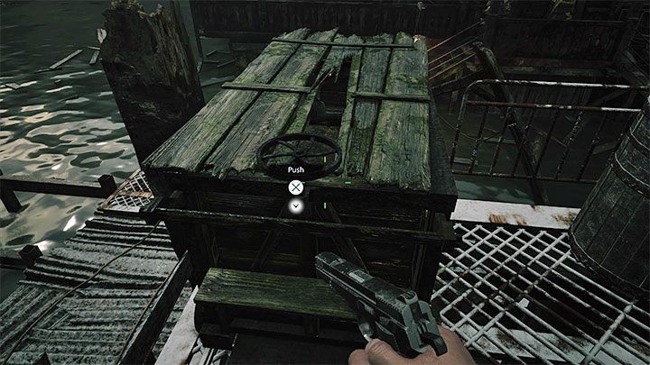 Ethan will get to a larger building and here, you'll have ti push the carriage shown in the picture - Resident Evil Village: Going through the reservoir, avoiding the fish - walkthrough - Fortress - Resident Evil Village Guide