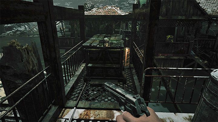 You will reach a new large wrecked building - Resident Evil Village: Going through the reservoir, avoiding the fish - walkthrough - Fortress - Resident Evil Village Guide
