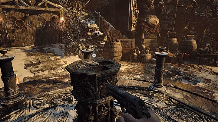 Return down the same path to the central part of the village, specifically to the Altar - Resident Evil Village: Fighting Moreau and leaving the reservoir - walkthrough - Fortress - Resident Evil Village Guide