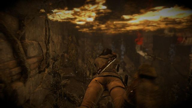 You need to dive under the Greek fire floating on the surface of the water - Find a way out of the archives with the Atlas | Dark Waters - Dark Waters - Rise of the Tomb Raider Game Guide & Walkthrough