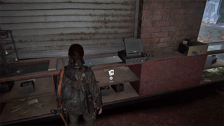 The card is under the counter - The Last of Us 2: The Flooded City - collectibles, artefacts, coins - Seattle, Day 3 - Ellie - The Last of Us 2 Guide