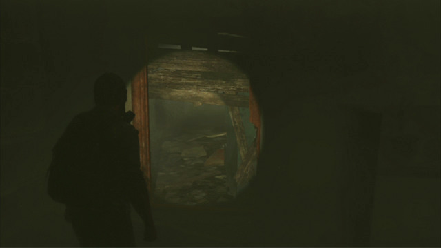Further passage is through the hole to the left - Beyond the Wall (text & map) | The Quarantine Zone | The Last of Us Walkthrough - The Quarantine Zone - The Last of Us Guide