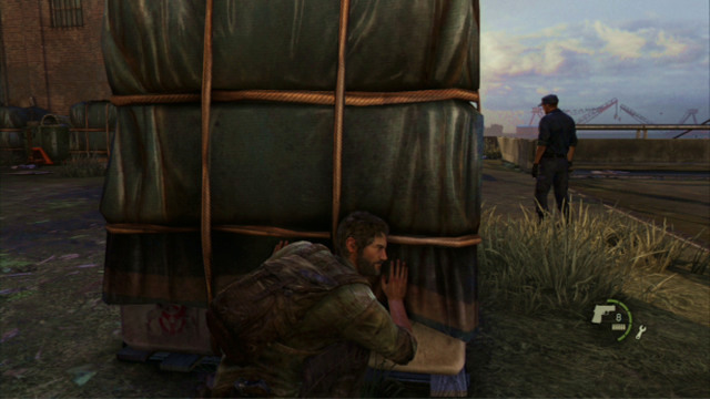 To eliminate the remaining enemies, take cover behind the cargo crate and wait for the two soldiers to turn away from you - The Cargo (text & map) | The Quarantine Zone | The Last of Us Walkthrough - The Quarantine Zone - The Last of Us Guide
