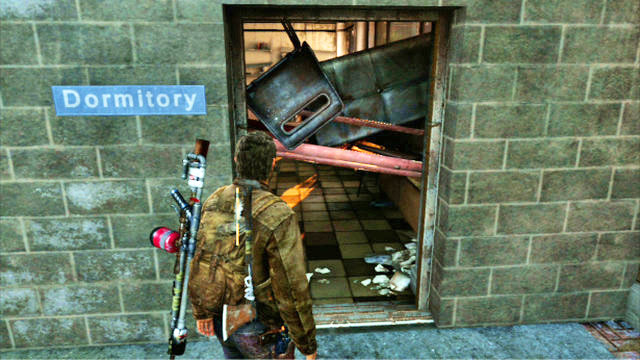 The path will take you to a locked gate, which you can get around by squeezing through the barricaded door to the right - Go Big Horns! | The University | The Last of Us Walkthrough - The University - The Last of Us Guide