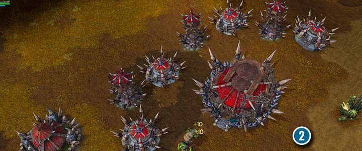 Ork-Gebäude können mit speziellen Stacheln verstärkt werden, die die Verteidigung Ihrer Gebäude stärken.  Dies ist eine einzigartige Ork-Verbesserung, die Einheiten in der Nähe der Gebäude Schaden zufügt.  - Schrei des Kriegshymnenklans |  Komplettlösung für Warcraft III Reforged – Ork-Kampagne – Warcraft III Reforged-Leitfaden