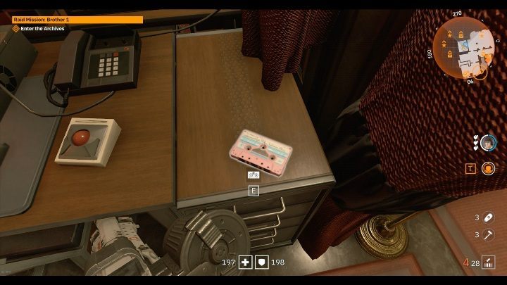 On a large wooden desk there is a small pink cassette - Secrets and collectibles in Brother 1 | Wolfenstein Youngblood - Collectibles and secrets - Wolfenstein Youngblood Guide