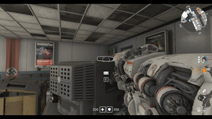 Theres a black cover on a desk next to the supply crate, its on a monitor - Secrets and collectibles in Brother 3 | Wolfenstein Youngblood - Collectibles and secrets - Wolfenstein Youngblood Guide